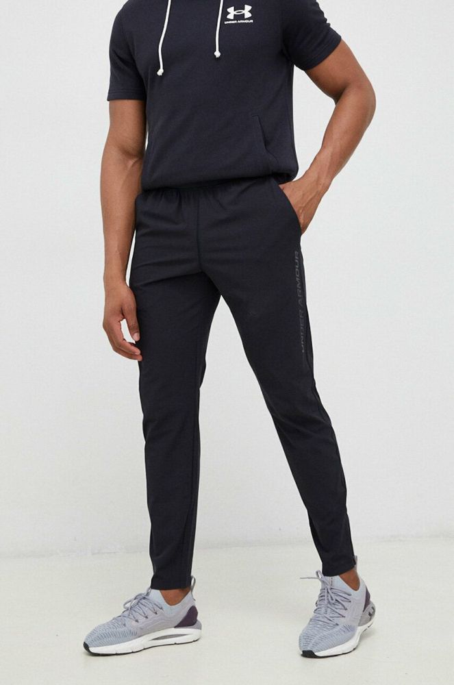 Штани для бігу Under Armour Storm колір чорний однотонні